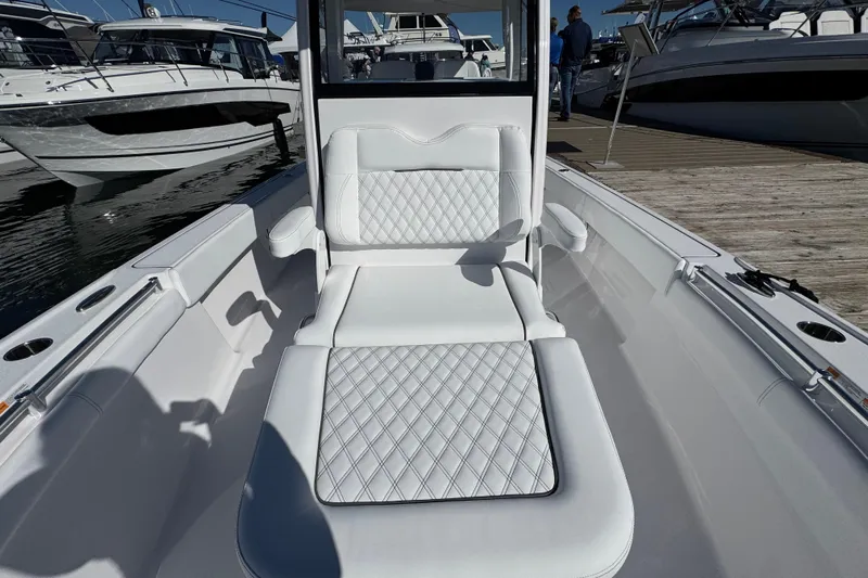  Yacht Photos Pics 2025 Sportsman Masters 267OE Bay Boat interior with luxurious white seating and diamond stitching.