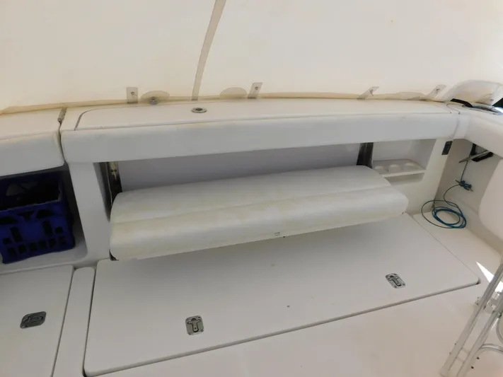 Cap & Dan Yacht Photos Pics 2001 Tiara Yachts 3800 Open interior with foldable bench seat and storage compartments.