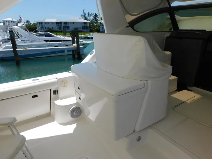 Cap & Dan Yacht Photos Pics 2001 Tiara Yachts 3800 Open interior with seating, docked at marina.