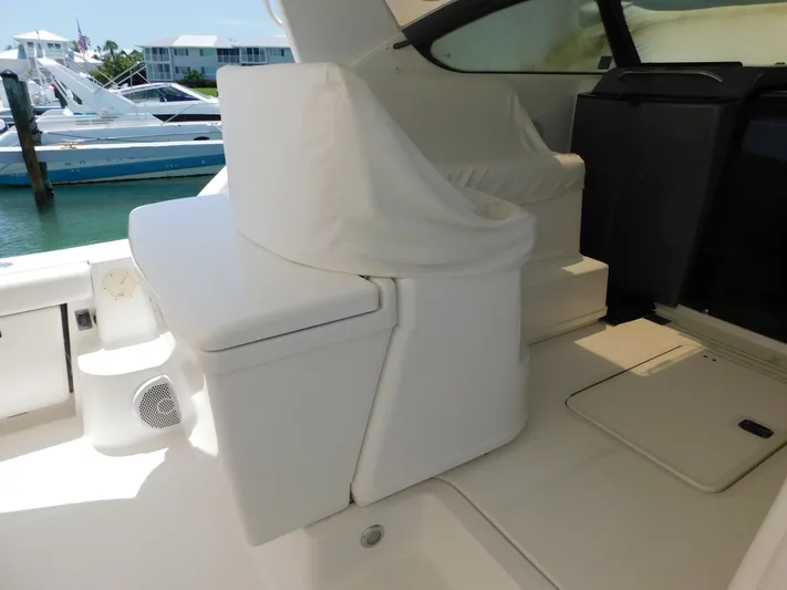 Cap & Dan Yacht Photos Pics 2001 Tiara Yachts 3800 Open interior with white seating and covered helm.