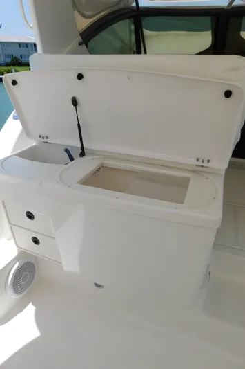 Cap & Dan Yacht Photos Pics 2001 Tiara Yachts 3800 Open boat interior with storage compartment open.