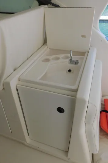Cap & Dan Yacht Photos Pics 2001 Tiara Yachts 3800 Open boat sink and storage area.