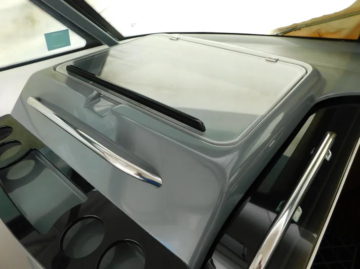 Cap & Dan Yacht Photos Pics Dashboard of a 2001 Tiara Yachts 3800 Open, featuring sleek design and cup holders.