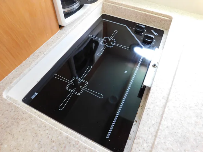 Cap & Dan Yacht Photos Pics Ceramic cooktop in 2001 Tiara Yachts 3800 Open galley kitchen.