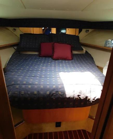 Cap & Dan Yacht Photos Pics 2001 Tiara Yachts 3800 Open cabin interior with bed and pillows.