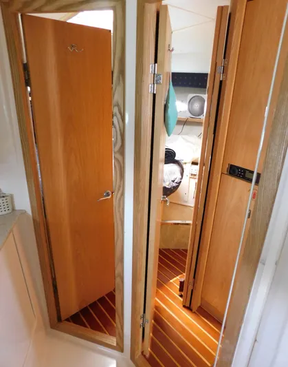 Cap & Dan Yacht Photos Pics Interior view of 2001 Tiara Yachts 3800 Open, featuring wooden doors and flooring.