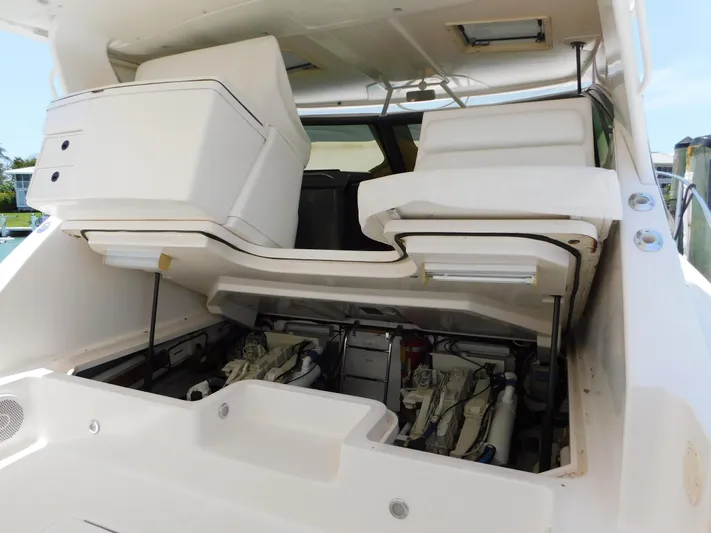 Cap & Dan Yacht Photos Pics 2001 Tiara Yachts 3800 Open engine compartment with open hatch, showcasing dual engines.
