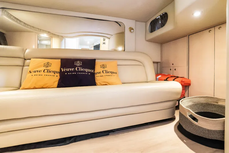 Decadance Yacht Photos Pics Interior of 2003 Sea Ray 460 Sundancer yacht with beige seating and decorative pillows.