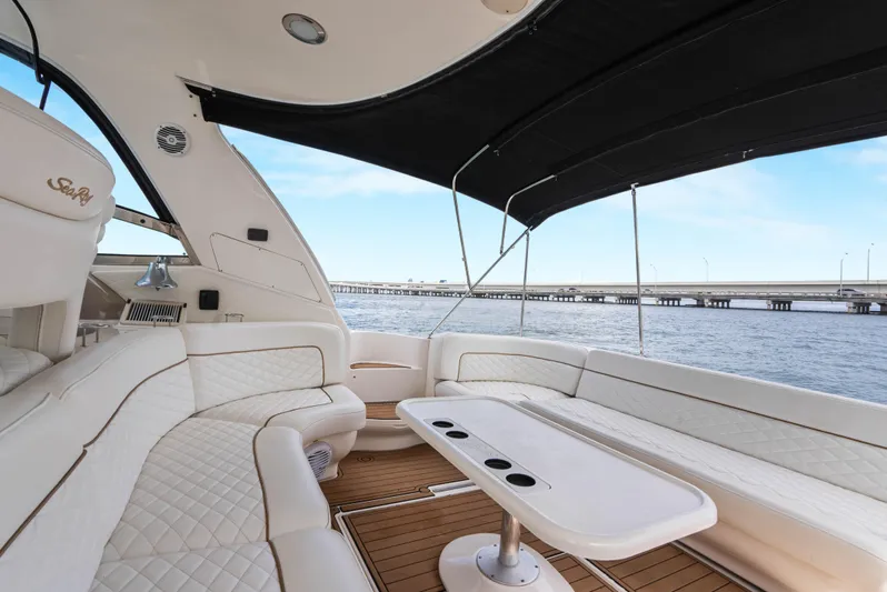 Decadance Yacht Photos Pics Luxurious 2003 Sea Ray 460 Sundancer yacht interior with elegant seating and ocean view.