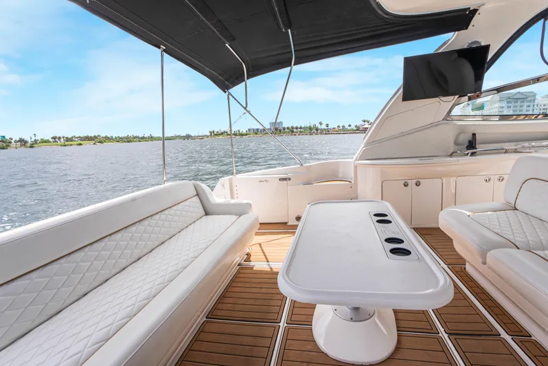 Decadance Yacht Photos Pics Luxurious 2003 Sea Ray 460 Sundancer yacht interior with elegant seating and scenic water view.