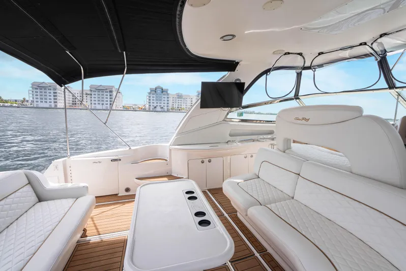 Decadance Yacht Photos Pics Luxurious 2003 Sea Ray 460 Sundancer yacht interior with white seating and waterfront view.