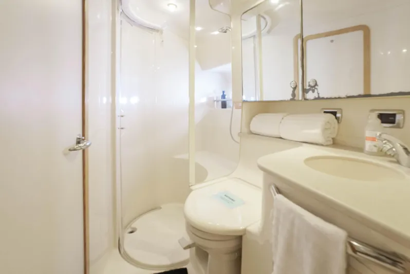 Decadance Yacht Photos Pics Luxurious bathroom in 2003 Sea Ray 460 Sundancer yacht with shower and vanity.