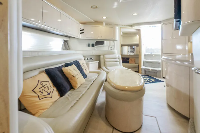 Decadance Yacht Photos Pics Luxurious interior of a 2003 Sea Ray 460 Sundancer yacht with elegant seating and decor.