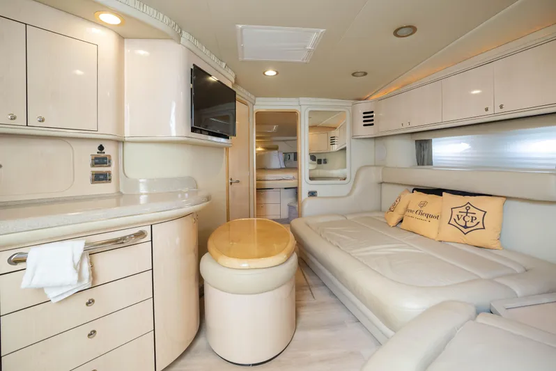 Decadance Yacht Photos Pics Luxurious interior of 2003 Sea Ray 460 Sundancer yacht with modern amenities and elegant design.