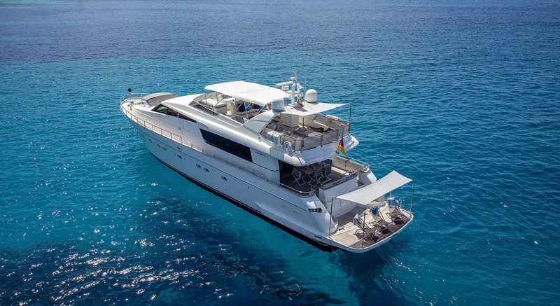 Easy Yacht Photos Pics Luxurious 2009 Sanlorenzo 82 yacht cruising on clear blue waters.