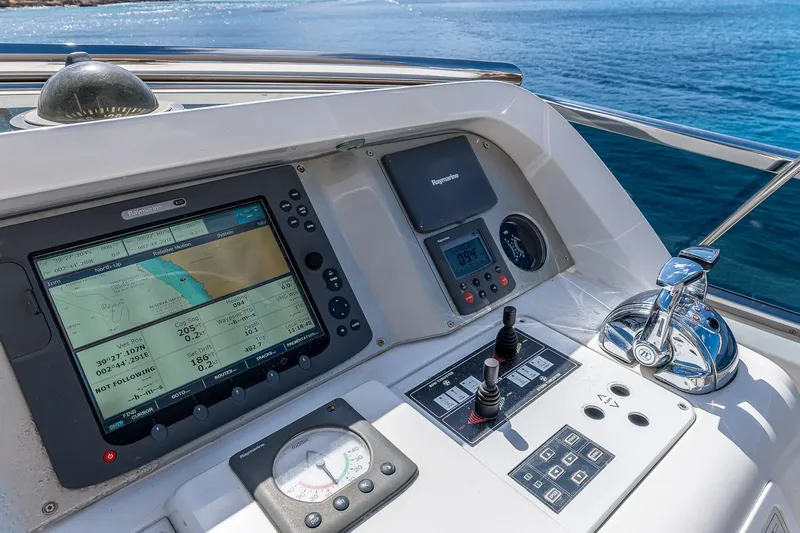 Easy Yacht Photos Pics Control panel of a 2009 Sanlorenzo 82 yacht with navigation equipment.
