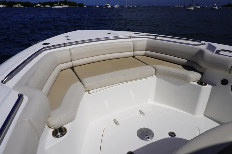 Vasea Yacht Photos Pics 2021 Boston Whaler 330 Outrage boat interior with cushioned seating, ocean view.