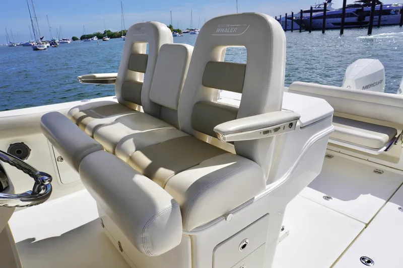 Vasea Yacht Photos Pics 2021 Boston Whaler 330 Outrage boat seats with ocean view in background.