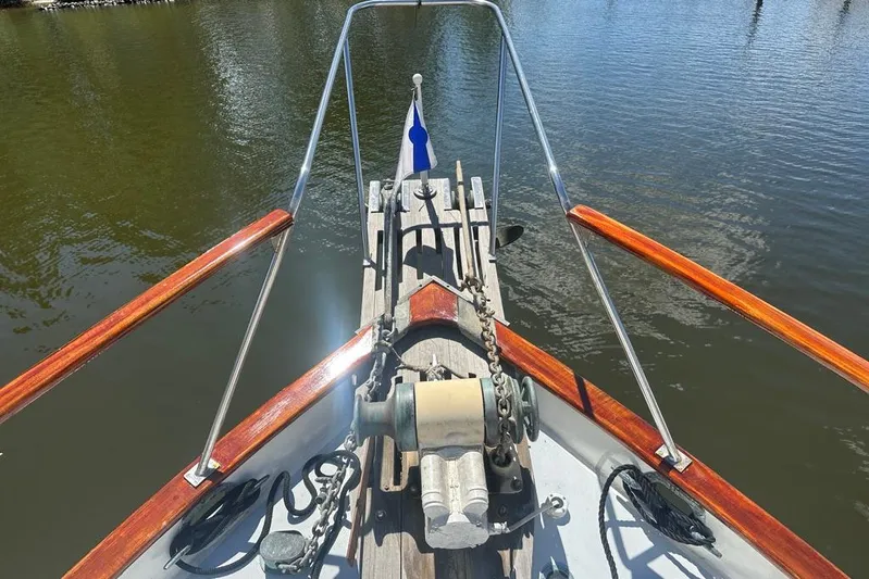  Yacht Photos Pics Bow view of 1983 Kadey-Krogen Krogen 42 Trawler on calm water.