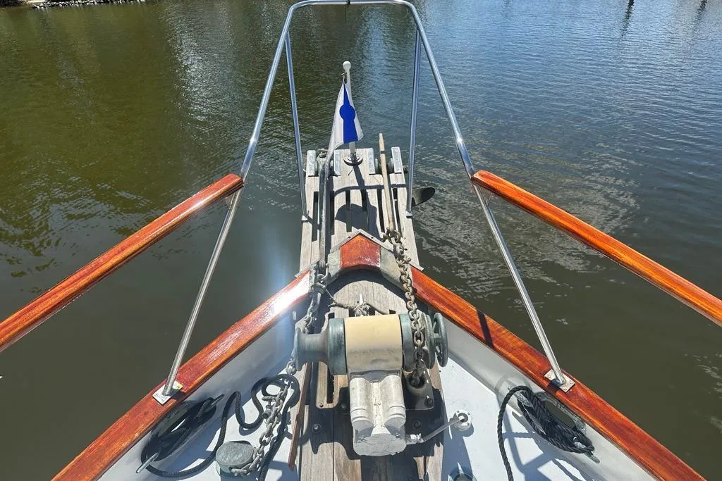 Bow view of 1983 Kadey-Krogen Krogen 42 Trawler on calm water.