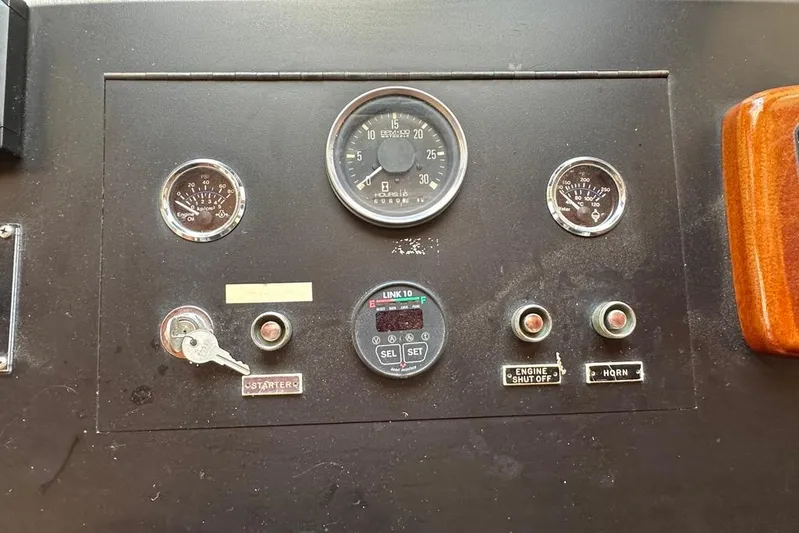  Yacht Photos Pics Control panel of a 1983 Kadey-Krogen Krogen 42 Trawler with gauges and switches.