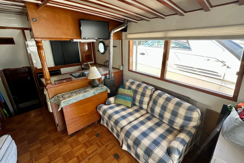  Yacht Photos Pics Interior of 1983 Kadey-Krogen Krogen 42 Trawler with cozy seating and kitchenette.