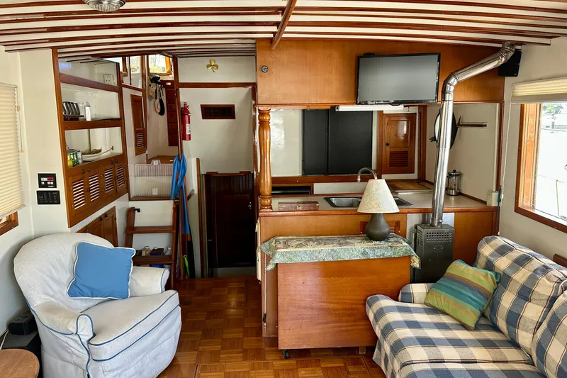  Yacht Photos Pics Interior of 1983 Kadey-Krogen Krogen 42 Trawler with cozy seating and wooden finishes.