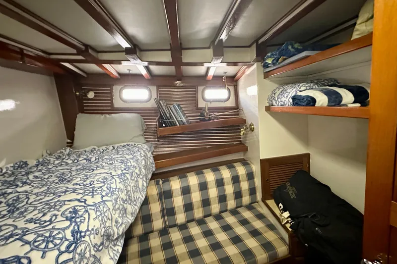  Yacht Photos Pics Cozy cabin interior of 1983 Kadey-Krogen Krogen 42 Trawler with bunk beds and storage.