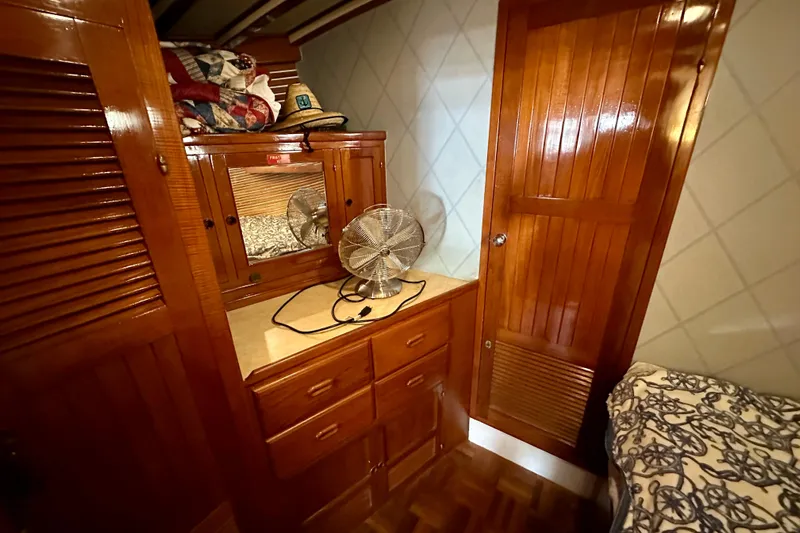  Yacht Photos Pics 1983 Kadey-Krogen Krogen 42 Trawler cabin with wooden cabinetry and fan.