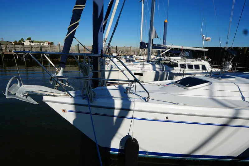 Summer Breeze Yacht Photos Pics Catalina 42 Mark II sailboat docked, 2002 model, with clear blue sky background.