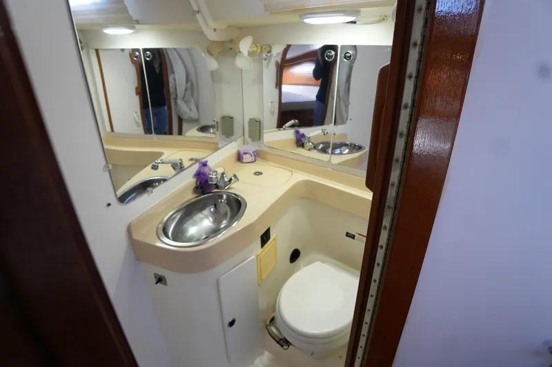 Summer Breeze Yacht Photos Pics Bathroom interior of 2002 Catalina 42 Mark II yacht with sink and toilet.