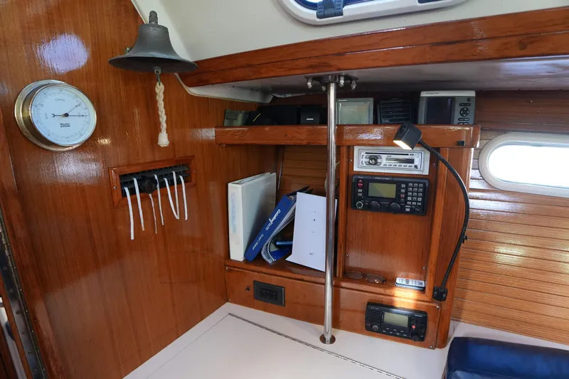 Summer Breeze Yacht Photos Pics Interior of 2002 Catalina 42 Mark II sailboat with navigation equipment and wooden finish.