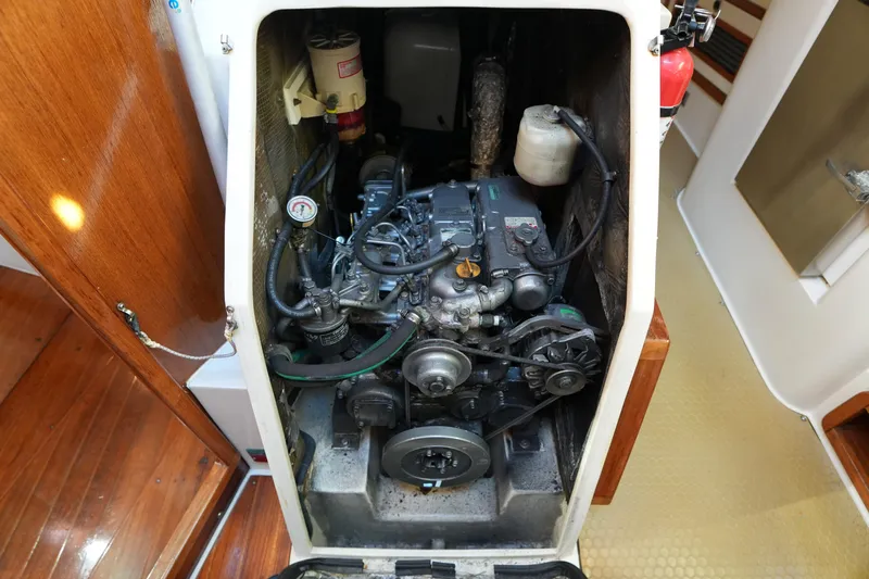 Summer Breeze Yacht Photos Pics Engine compartment of a 2002 Catalina 42 Mark II sailboat, showcasing mechanical components.