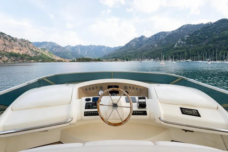 Senior S Yacht Photos Pics Cockpit view of 2004 Azimut 80 yacht with scenic mountain backdrop.