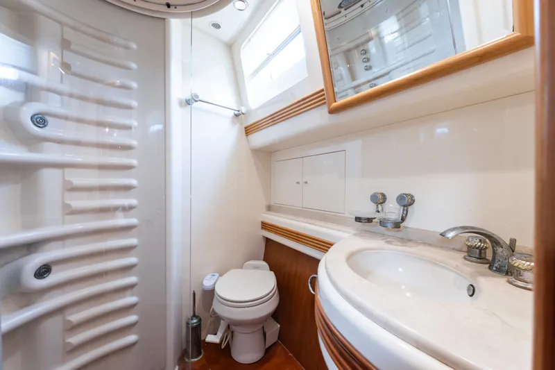 Senior S Yacht Photos Pics Luxurious bathroom in 2004 Azimut 80 yacht, featuring modern fixtures and elegant design.