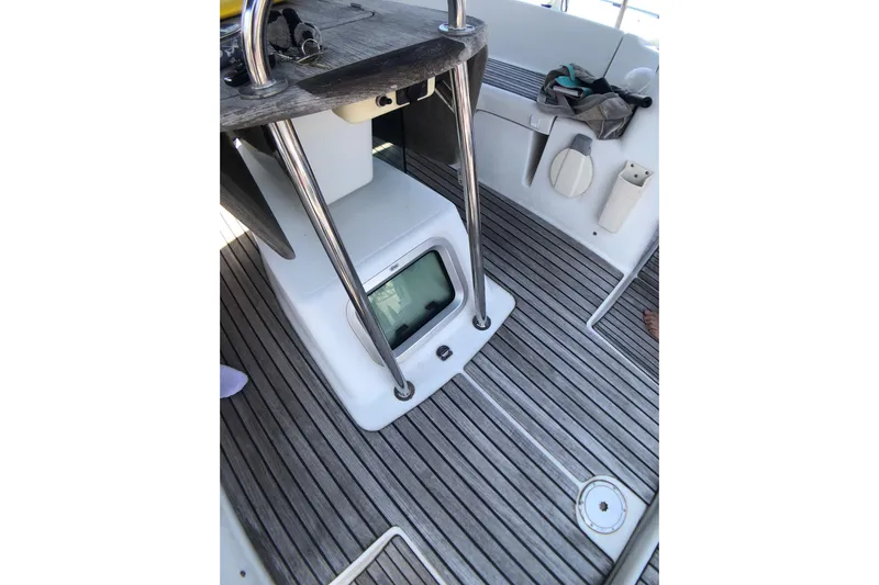 Marine Services S.a.s. Di Berruto Claudia Yacht Photos Pics Cockpit of 2006 Jeanneau Sun Odyssey 42 DS with wooden flooring and steering console.