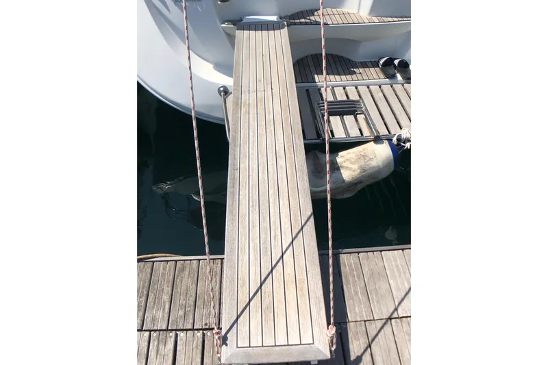 Marine Services S.a.s. Di Berruto Claudia Yacht Photos Pics Gangway of 2006 Jeanneau Sun Odyssey 42 DS yacht, docked with wooden deck.