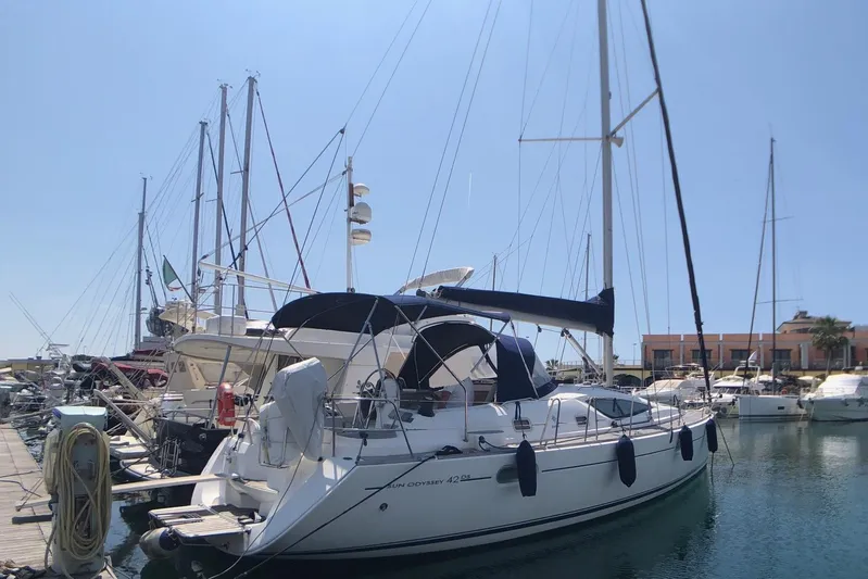 Marine Services S.a.s. Di Berruto Claudia Yacht Photos Pics 2006 Jeanneau Sun Odyssey 42 DS sailboat docked in marina under clear sky.