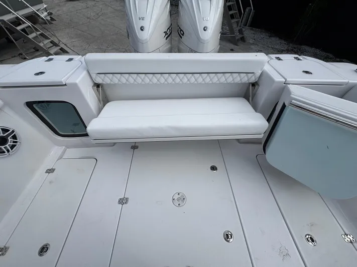  Yacht Photos Pics 2025 Sportsman Open 322 Center Console boat interior with seating and storage compartments.