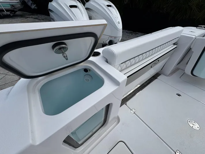  Yacht Photos Pics 2025 Sportsman Open 322 Center Console boat interior with open storage compartment and seating.