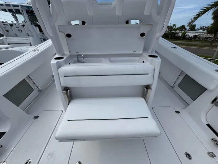  Yacht Photos Pics 2025 Sportsman Open 322 Center Console boat interior with seating and storage.