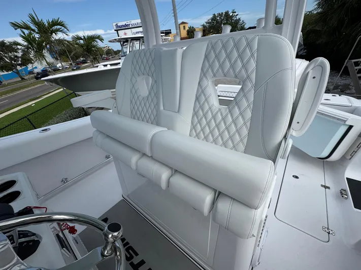  Yacht Photos Pics 2025 Sportsman Open 322 Center Console boat with luxurious white seating and modern design.