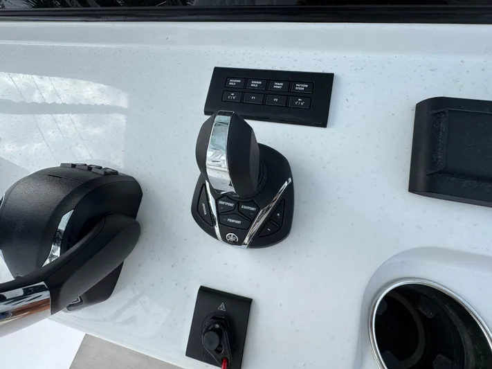  Yacht Photos Pics 2025 Sportsman Open 322 Center Console controls with joystick and buttons on dashboard.