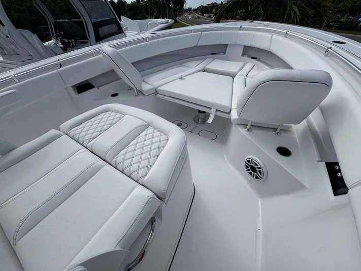  Yacht Photos Pics 2025 Sportsman Open 322 Center Console with luxurious white seating and modern design.