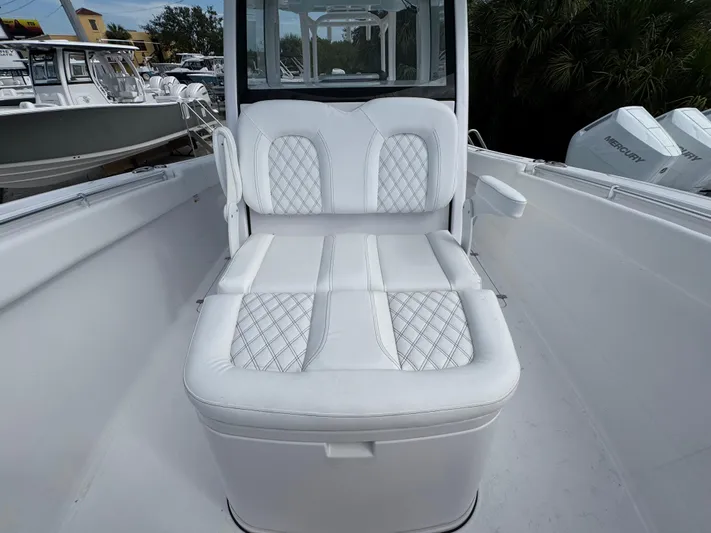  Yacht Photos Pics 2025 Sportsman Open 322 Center Console boat with white cushioned seating.