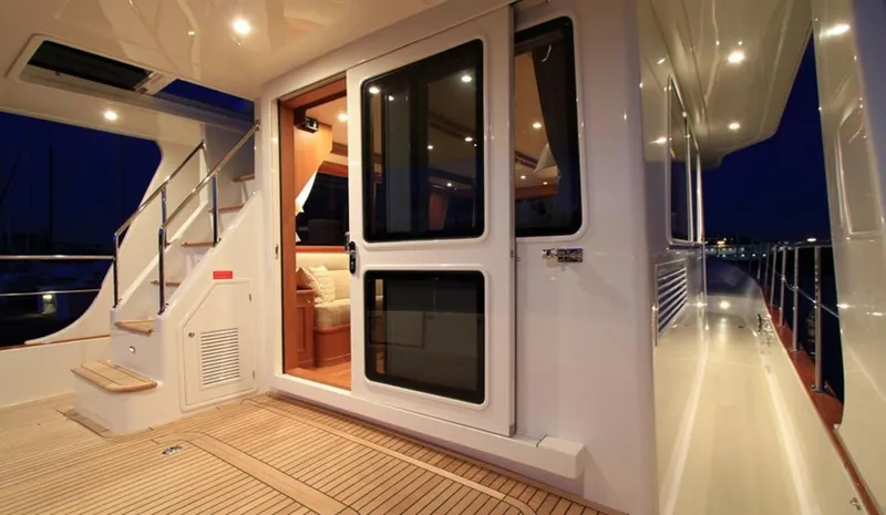 Hop Aboard Yacht Photos Pics 2015 Grand Banks 43 Heritage EU yacht deck and cabin entrance at night.