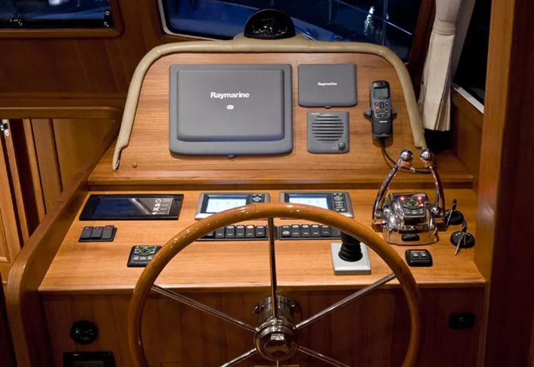 Hop Aboard Yacht Photos Pics Helm station of 2015 Grand Banks 43 Heritage EU with Raymarine electronics.