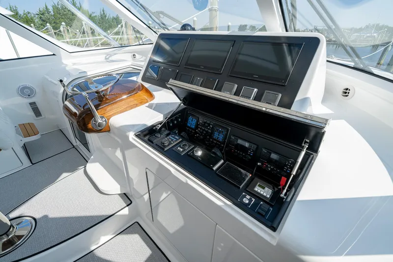 Pamela Yacht Photos Pics 2024 Viking 48 Sport Tower helm with advanced navigation controls and sleek design.
