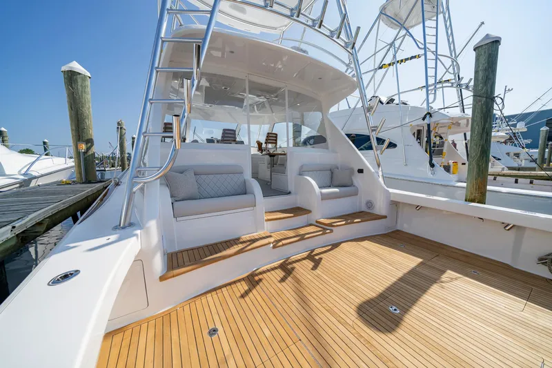 Pamela Yacht Photos Pics 2024 Viking 48 Sport Tower yacht with spacious deck and seating area.