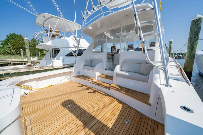 Pamela Yacht Photos Pics 2024 Viking 48 Sport Tower yacht with spacious deck and seating area.